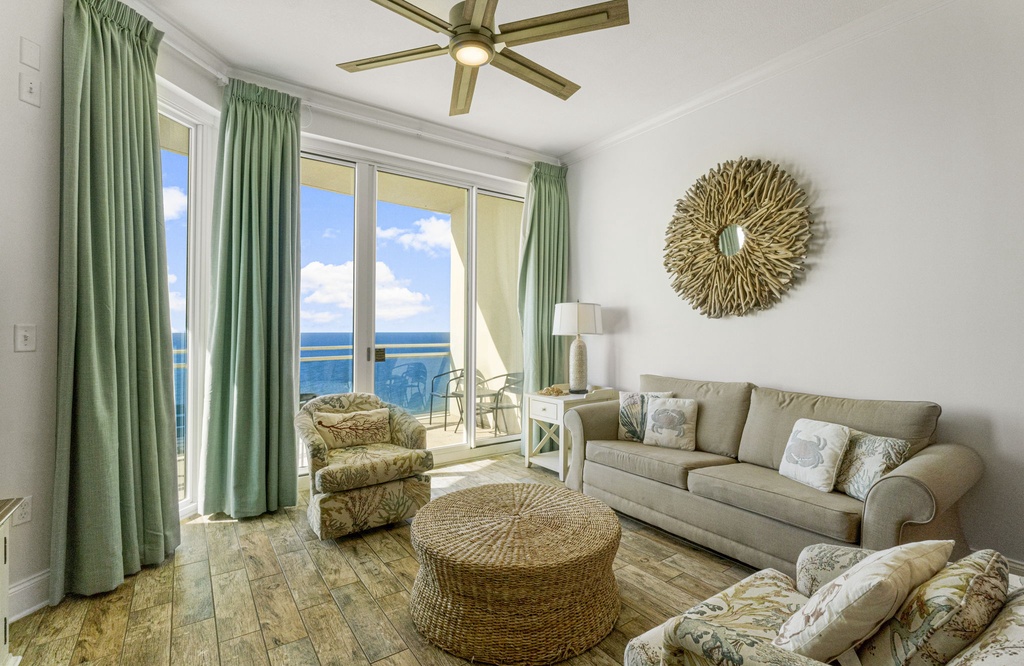 Relax in this coastal living room with ocean views and natural light.