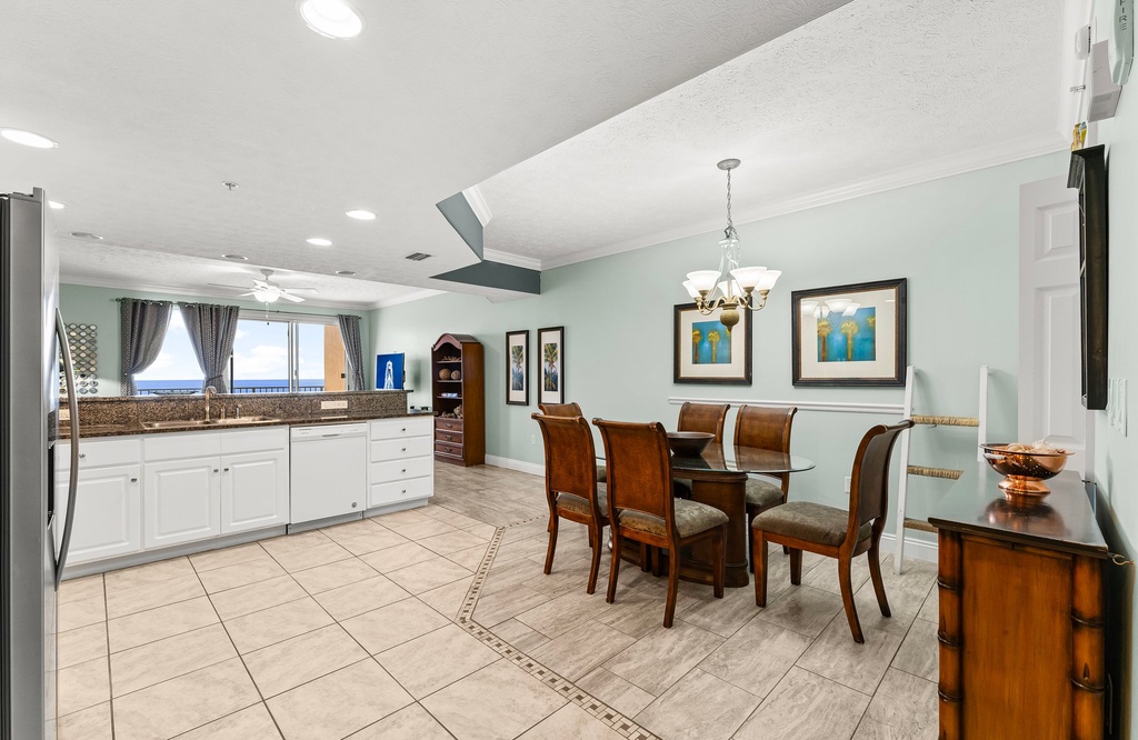 Airy dining area w/ tile floors & plenty of natural light for shared meals.