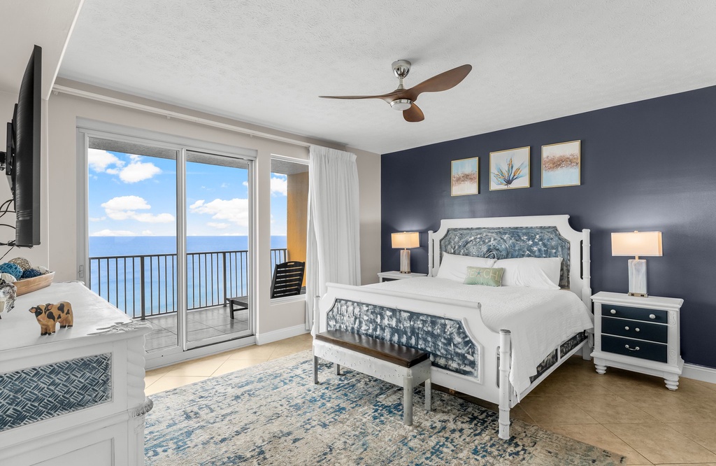 Relax in this coastal bedroom with ocean views and modern decor.