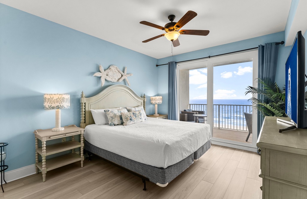 Relax in this coastal bedroom with ocean views and a balcony.