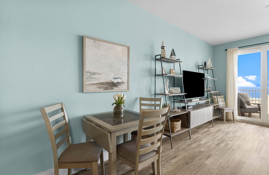 Coastal-inspired dining and living area with ocean views and natural light
