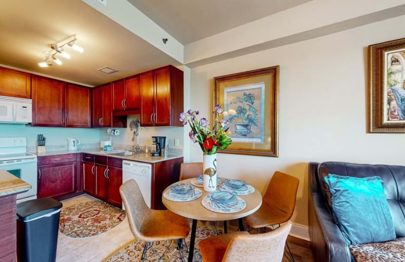 Step into your home away from home, where rich wood cabinetry meets modern comforts. Gather around the cozy dining table for morning coffee or evening meals.