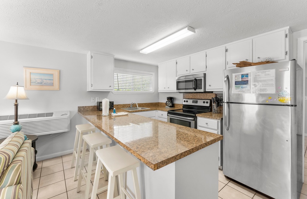 Modern kitchen with granite countertops and stainless steel appliances