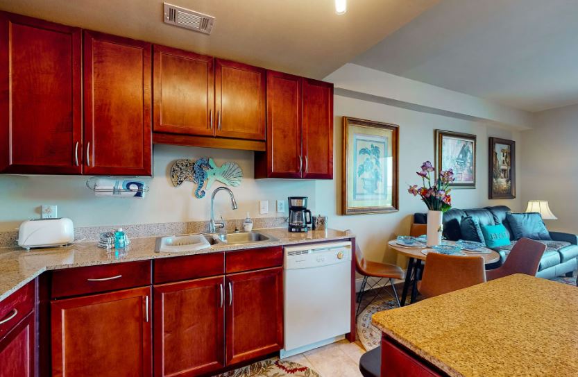 Your open-concept space combines a fully equipped kitchen with gleaming countertops and a cozy living area, perfect for relaxing after exploring the coast.