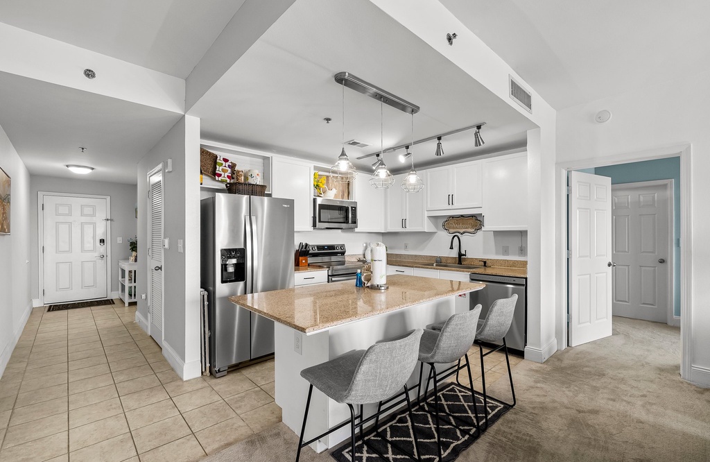 Modern kitchen with a large island and stainless steel appliances