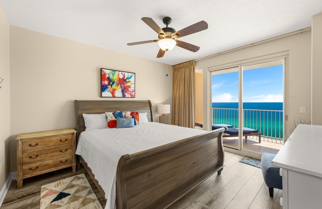 Relax in this modern bedroom with ocean views from the balcony.
