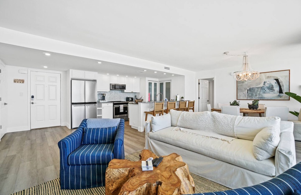 Sink into stylish comfort in this bright, open-plan living space where your modern kitchen, cozy seating, and elegant dining area flow seamlessly together for effortless relaxation and entertaining.