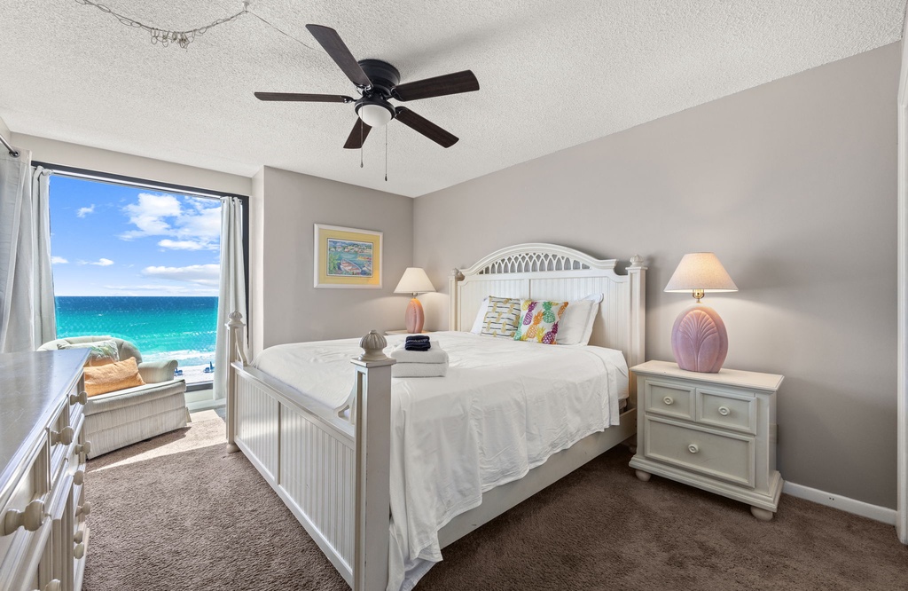 Relax in this coastal bedroom with ocean views and a calming neutral palette.