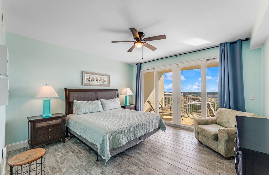 Relax in this modern bedroom with balcony access and scenic views.