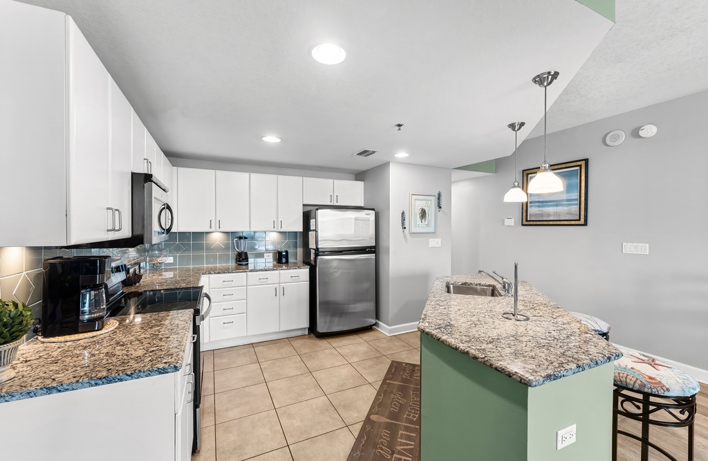 modern kitchen with granite countertops and stainless steel appliances