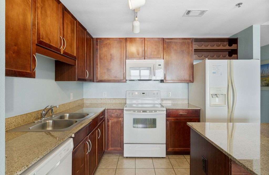kitchen with wooden cabinets and modern appliances