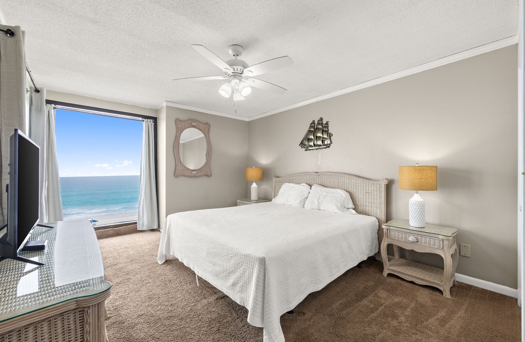 Relax in this coastal bedroom with ocean views and soft natural light.