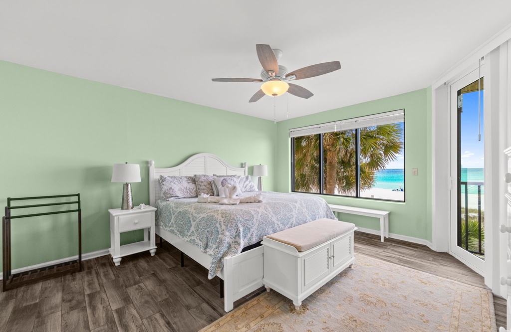 Wake up to breathtaking ocean views in the serene bedroom w/ soft natural light & tropical palms.