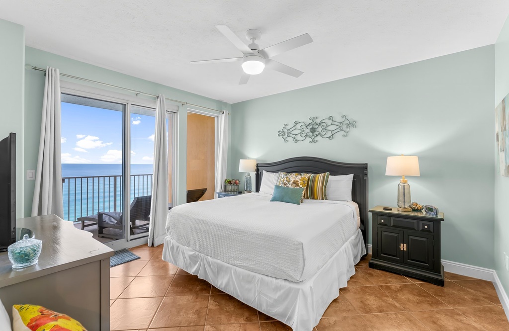 Relax in this coastal bedroom with ocean views and a private balcony.