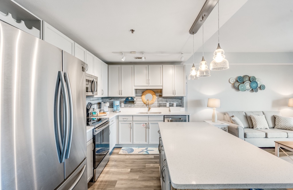 Modern kitchen with stainless steel appliances and a spacious island