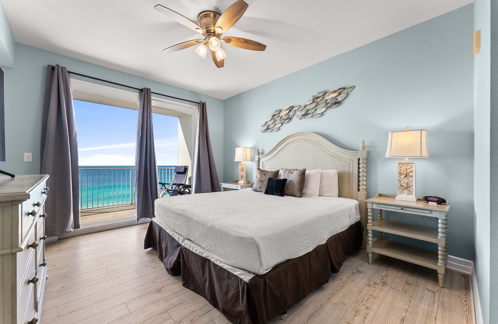 Relax in this coastal bedroom with ocean views and soft blue walls.