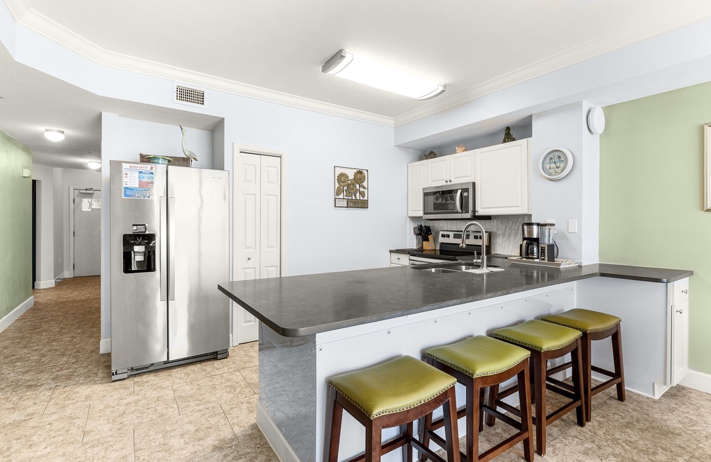 Modern kitchen with a large island and seating for four.