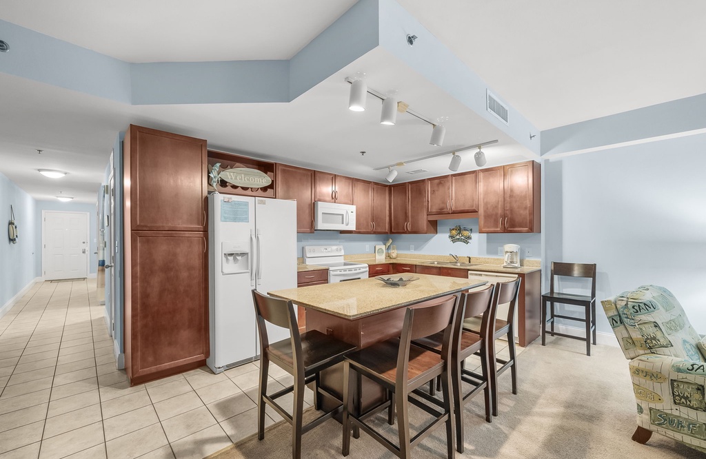 spacious kitchen with wooden cabinetry and a central island for dining