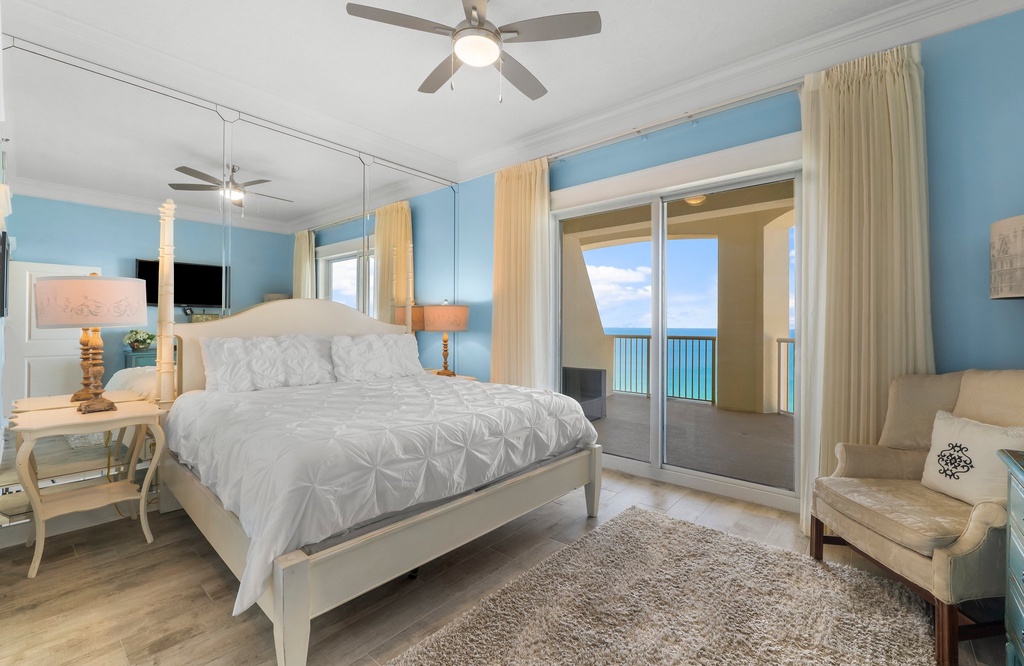 Relax in this coastal bedroom with ocean views and direct balcony access.