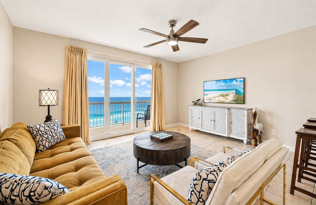 Relax in your bright living space with sweeping sea views framed by floor-to-ceiling glass doors. Sink into plush seating, enjoy the coastal breeze, and unwind as azure waters stretch endlessly before you.