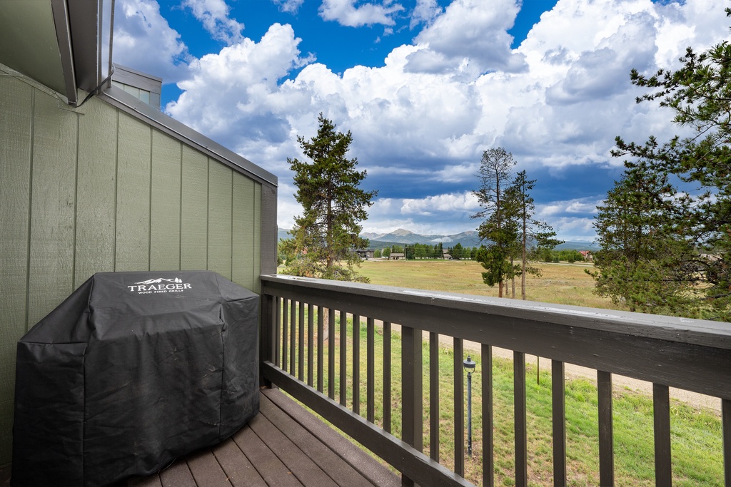 Scenic mountain views from your private balcony, complete with a covered BBQ grill for outdoor cooking while surrounded by nature.
