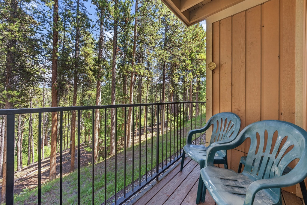 Step onto your private balcony and breathe in the fresh pine air as towering trees surround you. Settle into a chair and let the natural serenity wash over you.