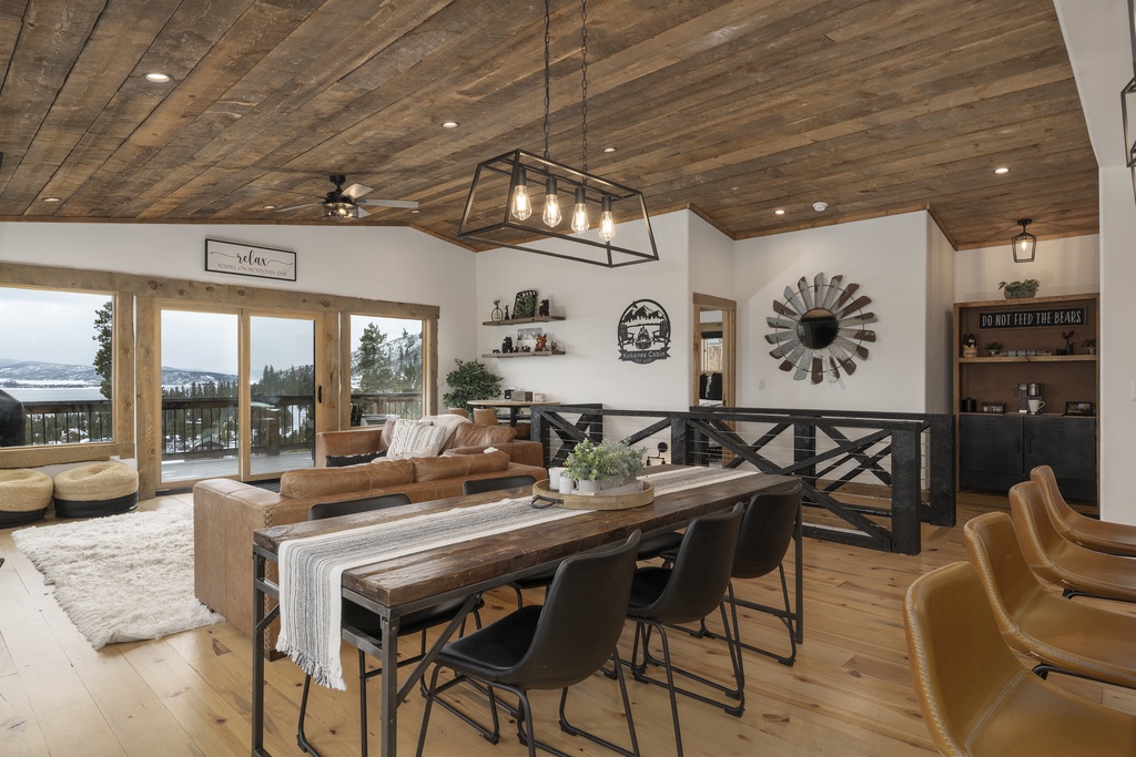 Gather around this stunning dining table at 224 GCR 4034 where rustic wood meets modern elegance, perfect for memorable meals with mountain views.