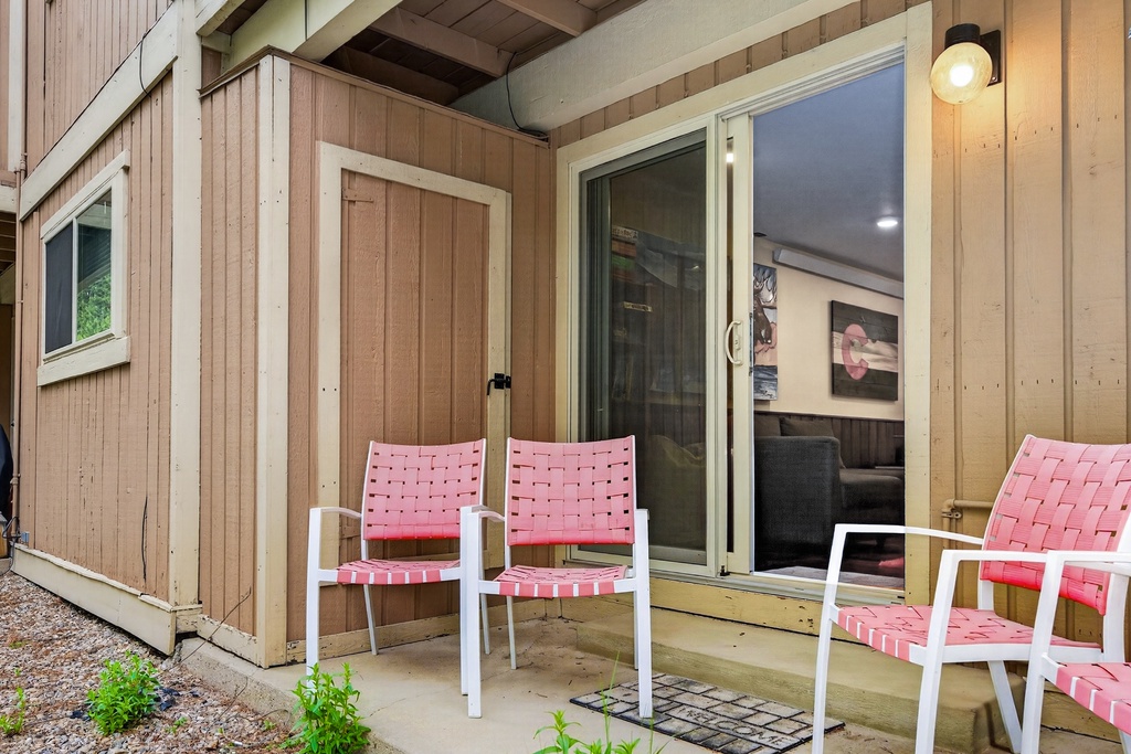 Unwind in your private outdoor space, furnished with comfy woven seating where you can sip morning coffee or enjoy the fresh air anytime.