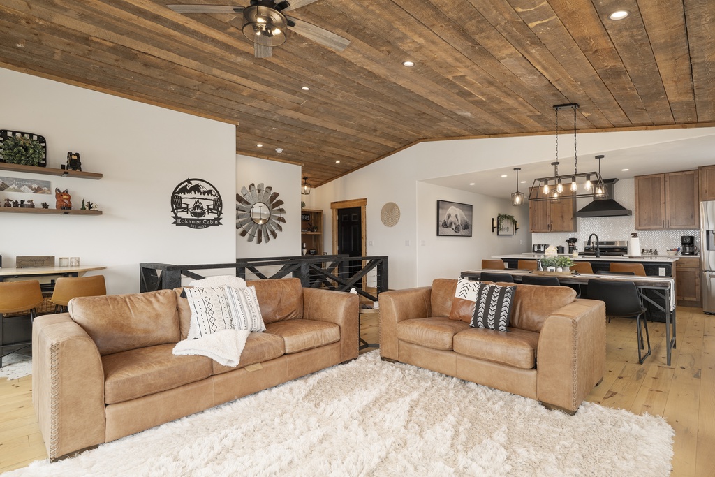 Sink into luxurious leather sofas beneath stunning wood beam ceilings in this open-concept retreat where mountain charm meets modern comfort at 224 GCR 4034.