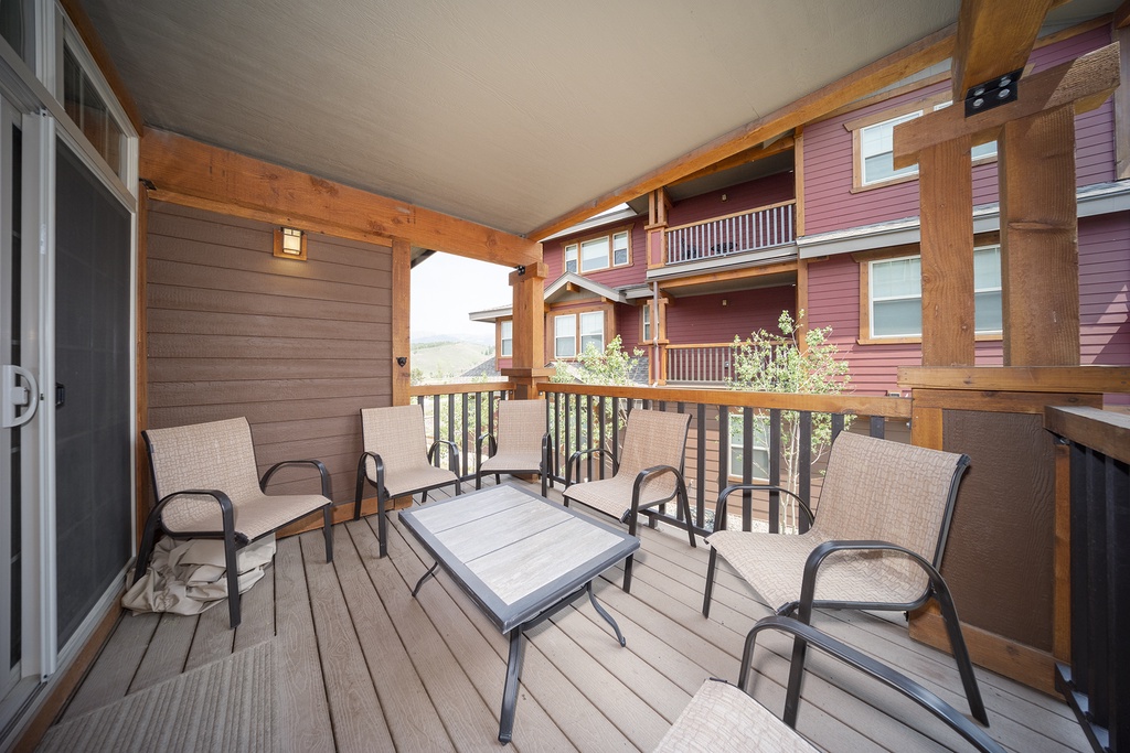 Unwind on your private covered balcony with comfortable seating for four, perfect for morning coffee or evening conversations.