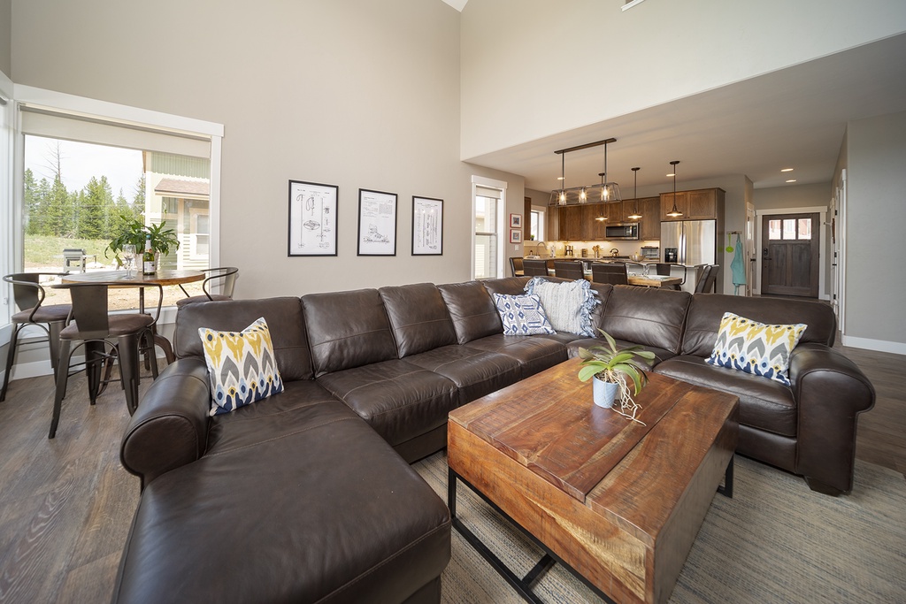 Sink into this spacious sectional and enjoy your morning coffee while taking in the open-concept design that flows seamlessly into the gourmet kitchen.