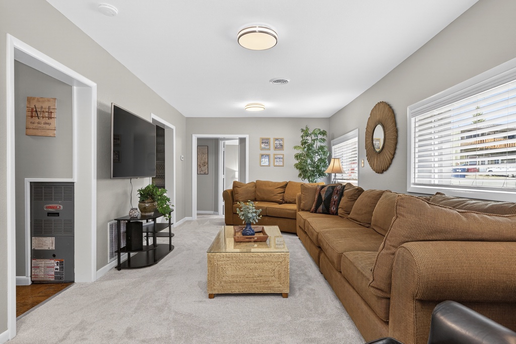 Sink into the plush sectional and unwind in your spacious, light-filled living room, perfect for movie nights or simply relaxing after a day of adventure.