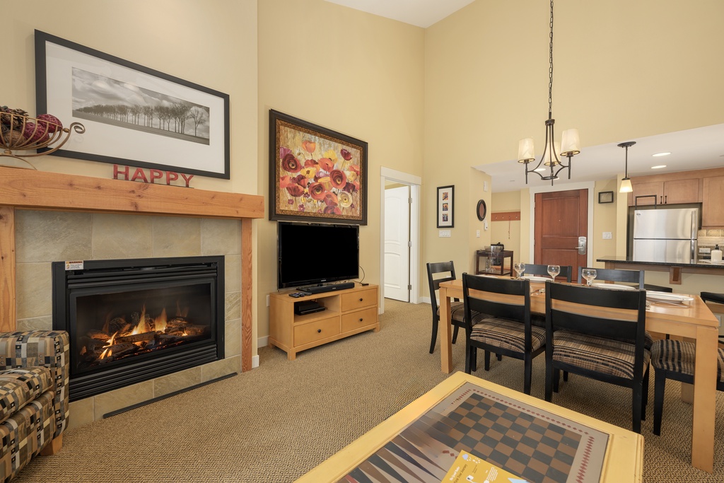 Cozy up by your crackling fireplace while enjoying meals at your dining table, with a full kitchen ready for your culinary adventures.