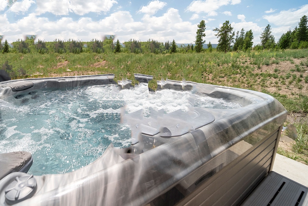 Soak your worries away in this bubbling hot tub while nature's beauty unfolds around you.