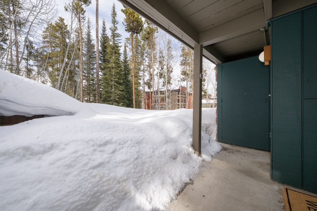 Step into your private winter sanctuary with heated floors and forest views beyond your covered patio.