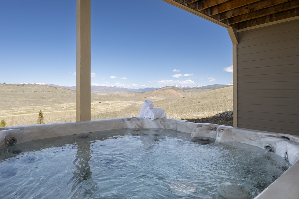 Soak in your private hot tub while gazing at endless mountain vistas and rolling hills stretching to the horizon.