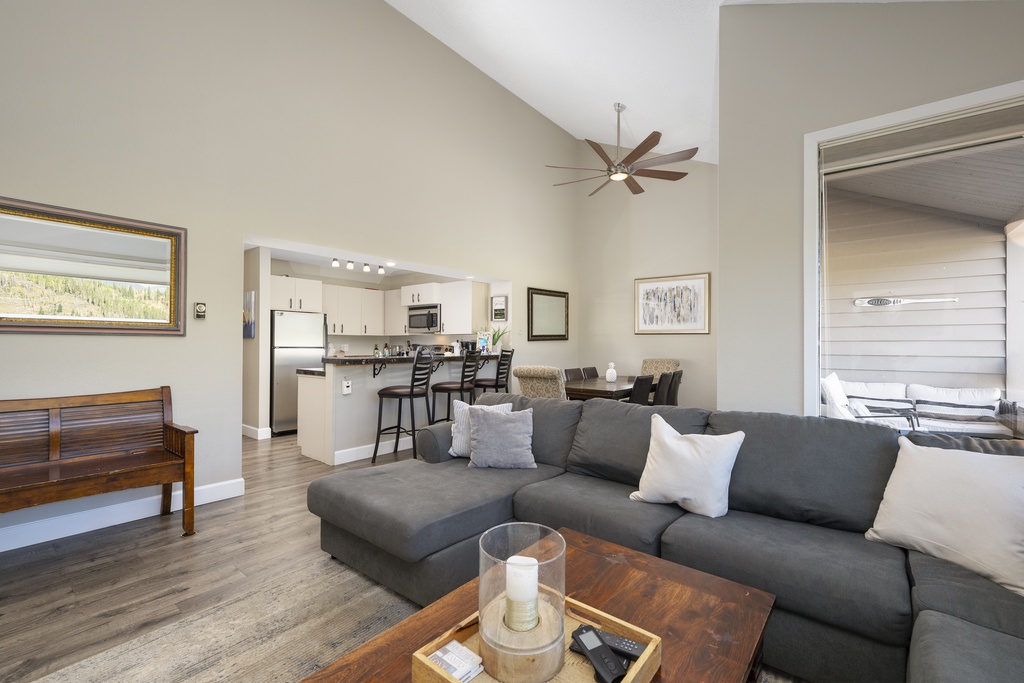 Relax in your spacious living room with comfortable sectional seating and enjoy the open concept flow to your fully equipped kitchen.