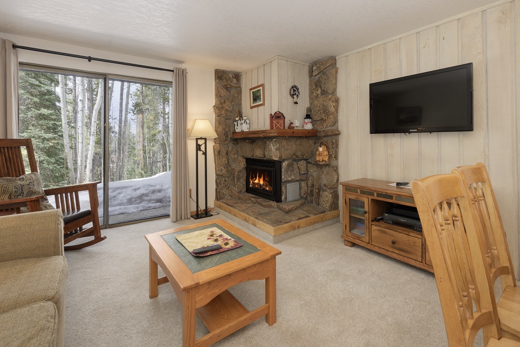 Cozy up by your crackling stone fireplace while snow blankets the forest outside your windows—mountain comfort at its finest.