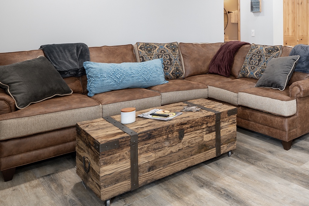 Sink into this cozy sectional with plush cushions and stylish pillows. Your perfect spot to unwind with coffee and magazines.