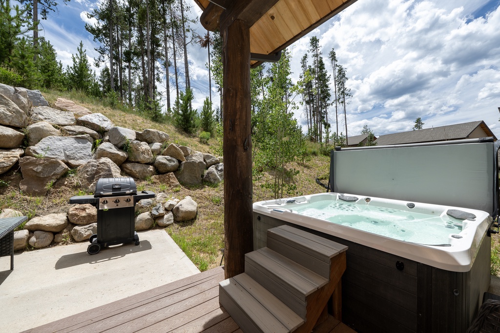 Soak in your private hot tub while gazing at towering pines and mountain vistas, then fire up the BBQ for an alpine dining experience.