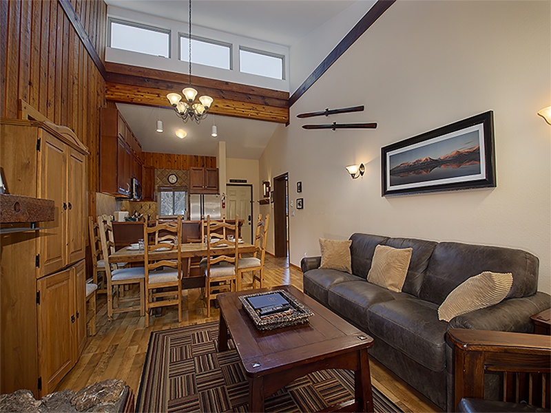 Relax in your cozy mountain retreat with rich wood details and soaring ceilings creating the perfect alpine atmosphere.