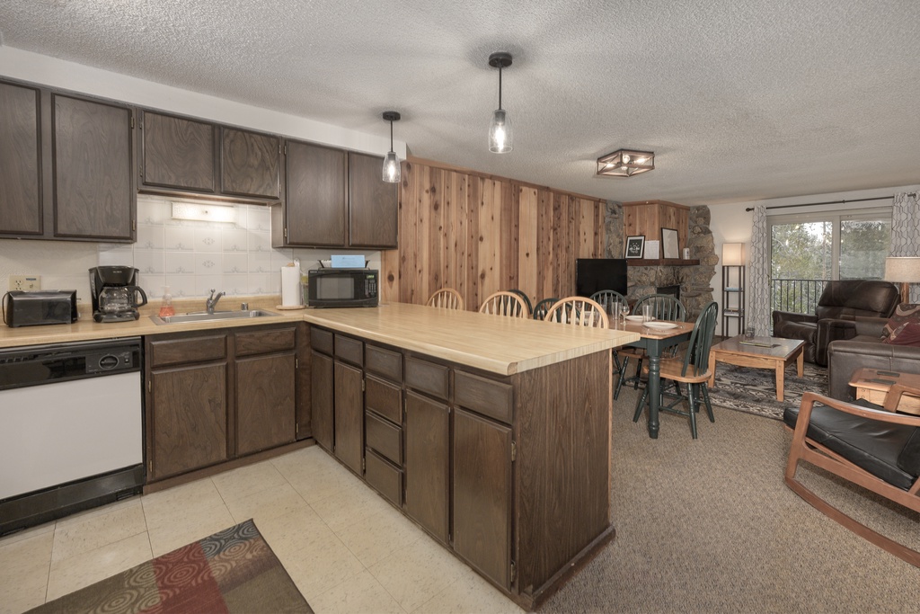 Your spacious open-concept kitchen flows seamlessly into the cozy living area, perfect for gathering with loved ones over home-cooked meals.