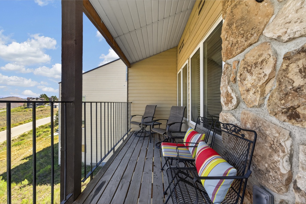 Settle into your private balcony and take in the peaceful neighborhood views. Comfortable seating invites you to savor morning coffee or watch the sunset over the quiet streets below.
