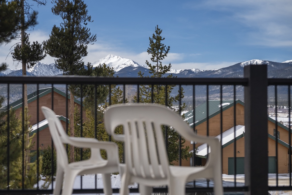 Stunning mountain panorama frames this peaceful balcony retreat where you can sip morning coffee surrounded by snow-capped peaks.
