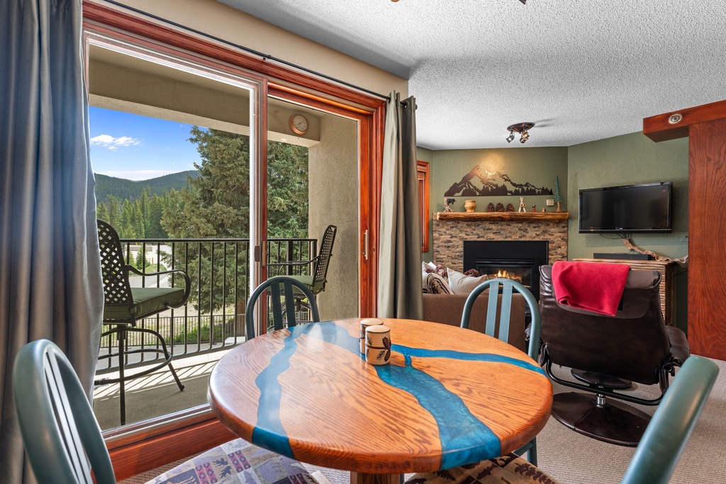 Unwind in your cozy space with mountain views from the balcony, a warm fireplace, and a unique artisan dining table that brings character to your stay.