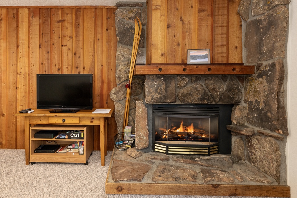 Cozy up beside your crackling stone fireplace while catching up on shows or unwinding with a good book.