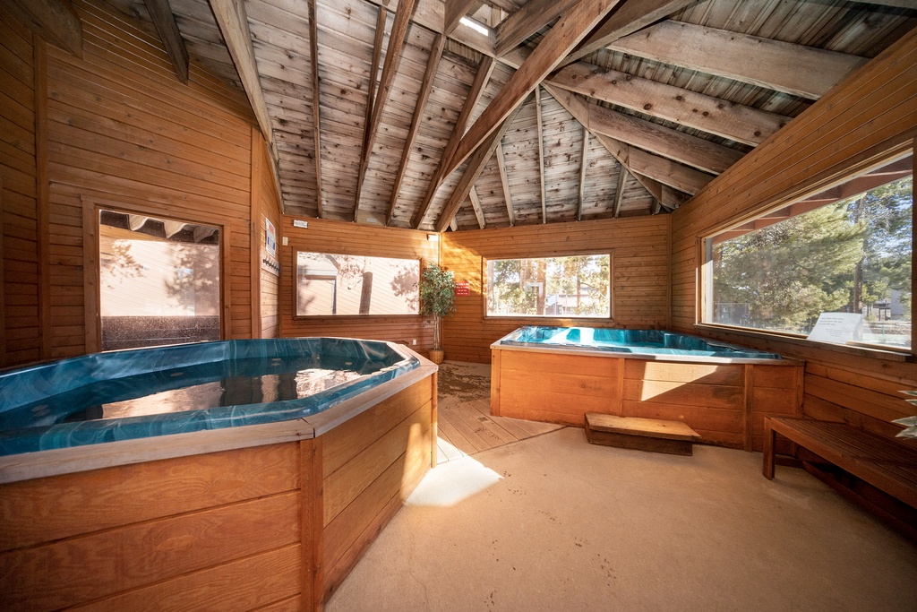 Soak your stress away in your private cedar hot tub sanctuary, where warm wood surrounds you with rustic charm.