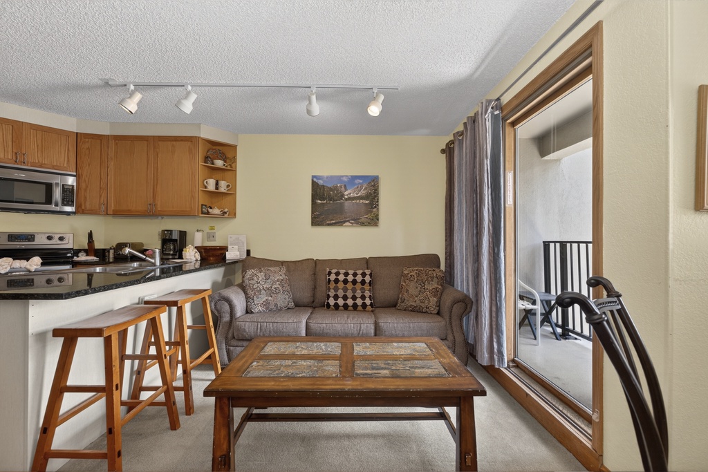 Relax in your cozy living space with a fully equipped kitchen at your fingertips and your own private balcony just steps away, perfect for morning coffee or evening unwinding.
