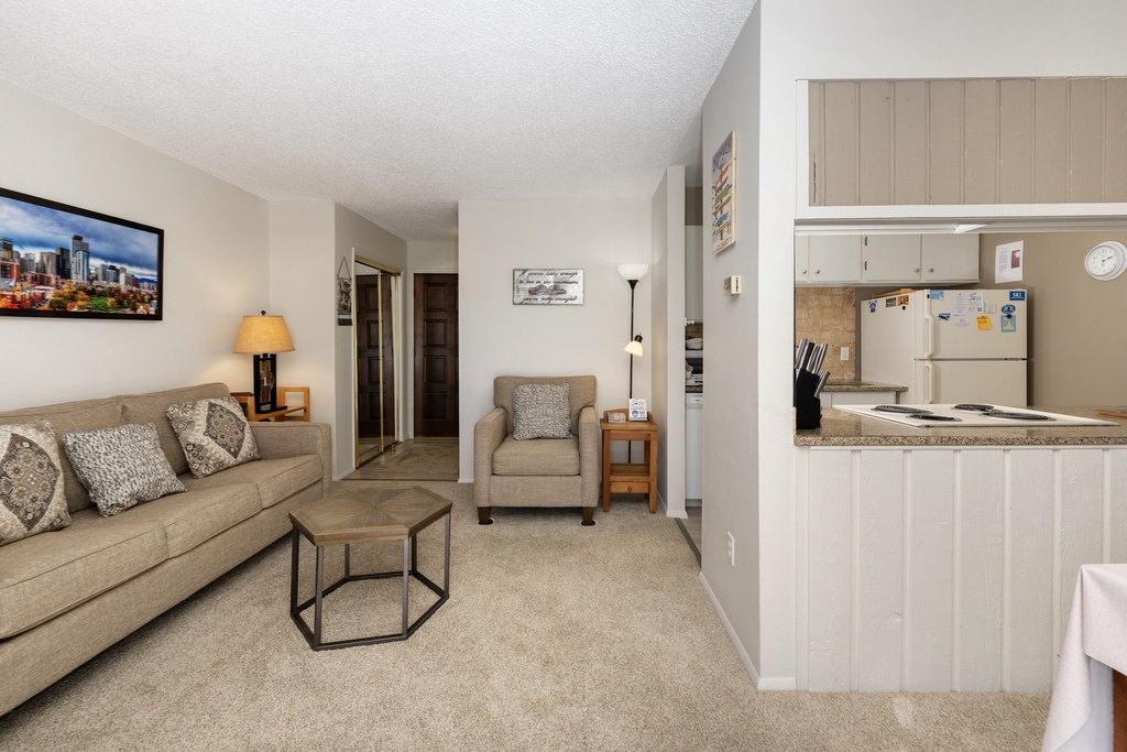 Unwind in your comfortable living space with modern furnishings and a fully equipped kitchen ready for your culinary adventures.