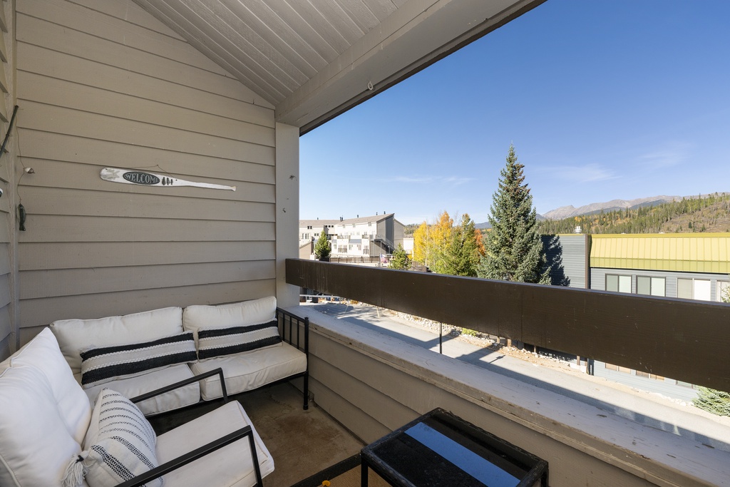 Unwind on your private mountain-view balcony with cozy seating, where autumn colors and crisp air create the perfect backdrop for morning coffee.